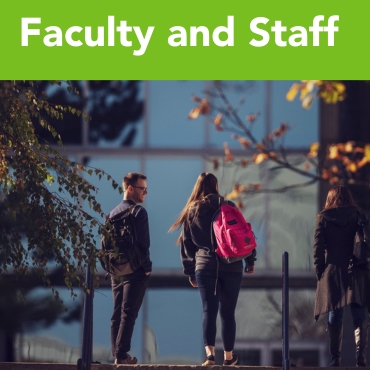 Students standing outside a building on the St. John's Campus.